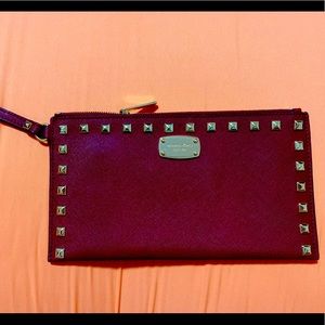 Michael Kors Burgundy Stud wristlet.